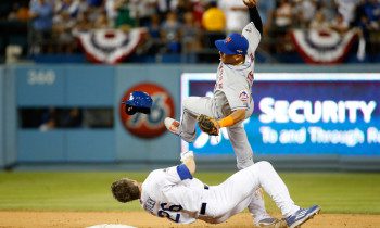 LOS ANGELES, CA - OCTOBER 10: Ruben Tejada #11 of the New York Mets is hit by a slide by Chase Utley #26 of the Los Angeles Dodgers in the seventh inning in an attempt to turn a double play in game two of the National League Division Series at Dodger Stadium on October 10, 2015 in Los Angeles, California. (Photo by Sean M. Haffey/Getty Images) 
