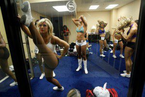 Baltimore Ravens cheerleader hopefuls warm up before taking to the stage during an event called "Making the Cut" to select the 2011 Baltimore Ravens cheerleaders in Baltimore