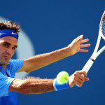 Roger Federer returns a shot during his victory over Grega Zemlja at the US Open