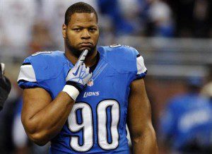 Detroit Lions' Ndamukong Suh stands on the field during warms-ups of their NFL football game against the Chicago Bears in Detroit