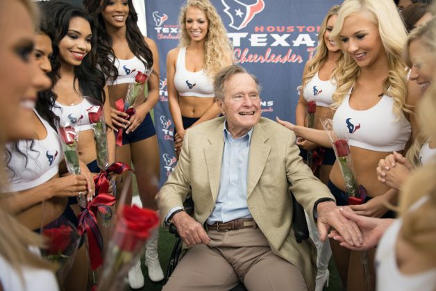 George Bush with cheerleaders