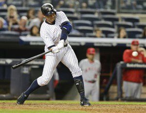 New York Yankees' Alex Rodriguez hits a single during the eighth inning of a baseball game against the Los Angeles Angels, Friday, June 5, 2015, in New York. The Yankees won 8-7. (AP Photo/Frank Franklin II)